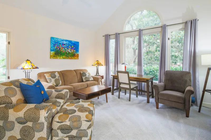 This cozy den, which has a queen sleeper sofa, looks out the front side of the home.