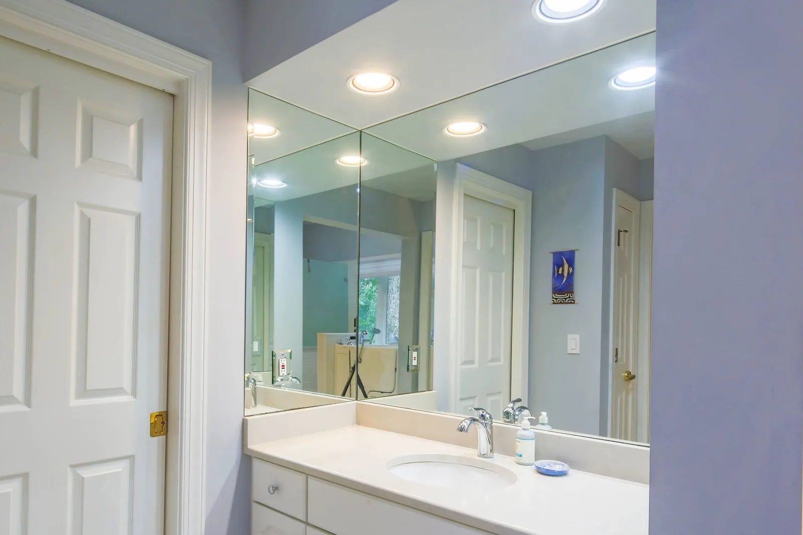 There are two vanities in the primary en suite bathroom.