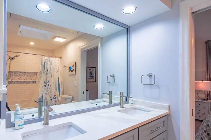 The Jack & Jill bathroom features a spacious, double sink vanity.