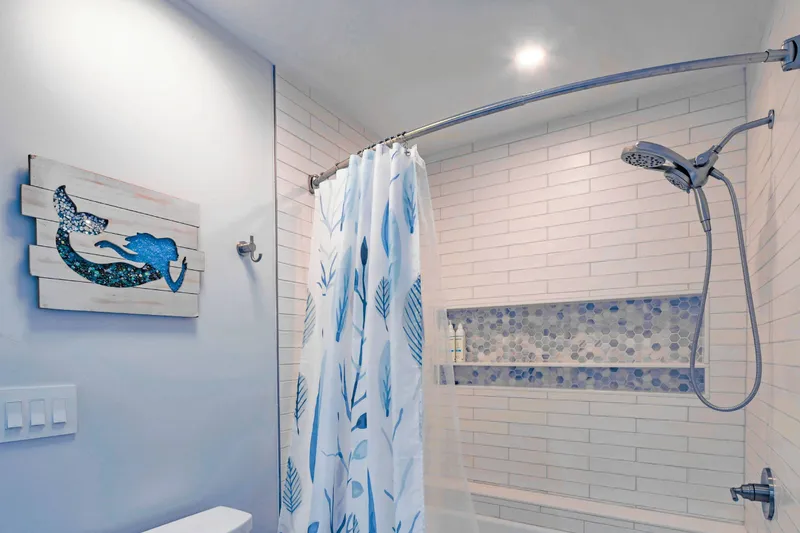 The Jack & Jill bathroom also has a beautifully-tiled shower/tub combo.