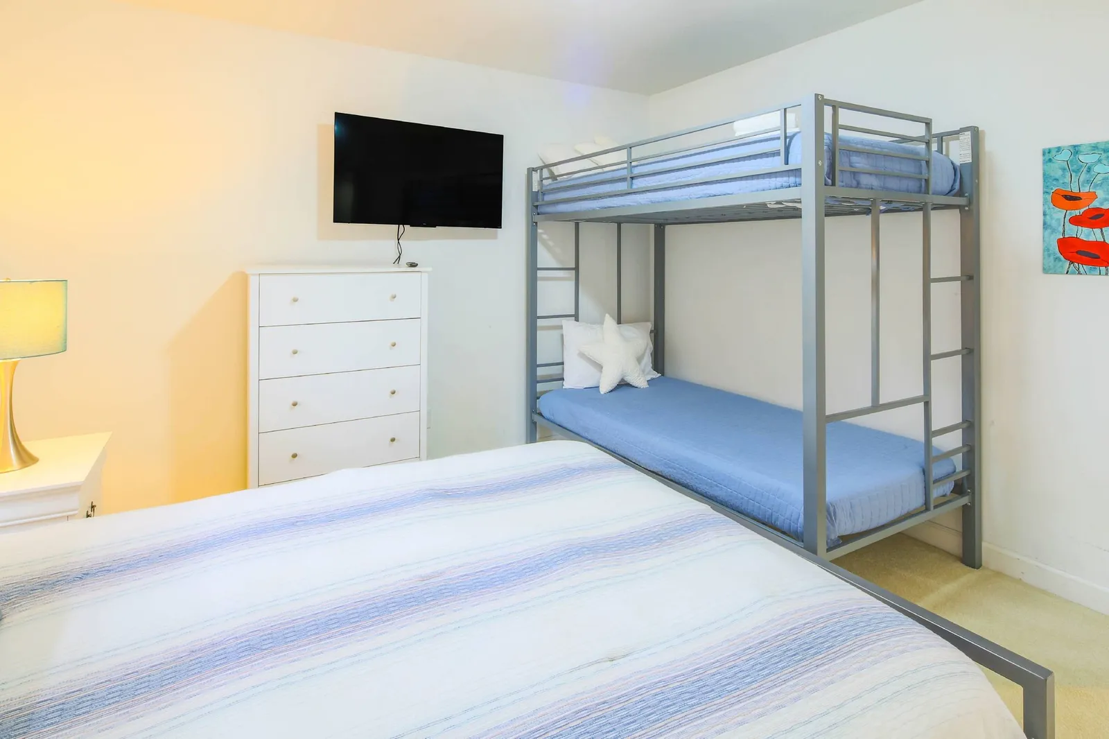 There is also a twin bunk bed and wall-mounted smart TV.