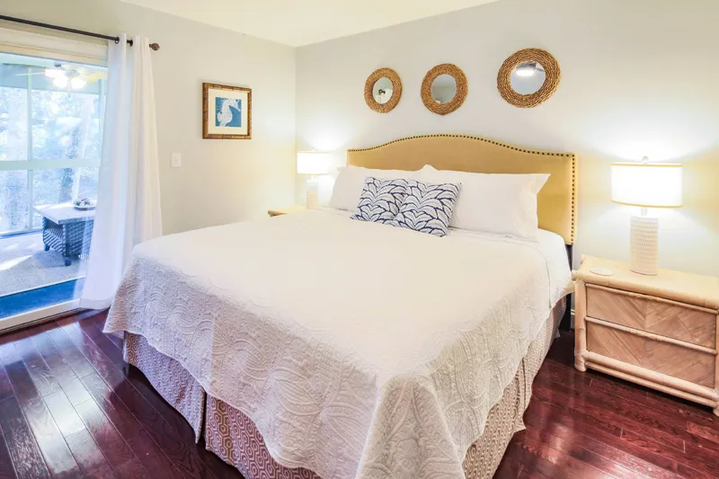 There is easy access to the serene screened porch via the primary suite and living room.