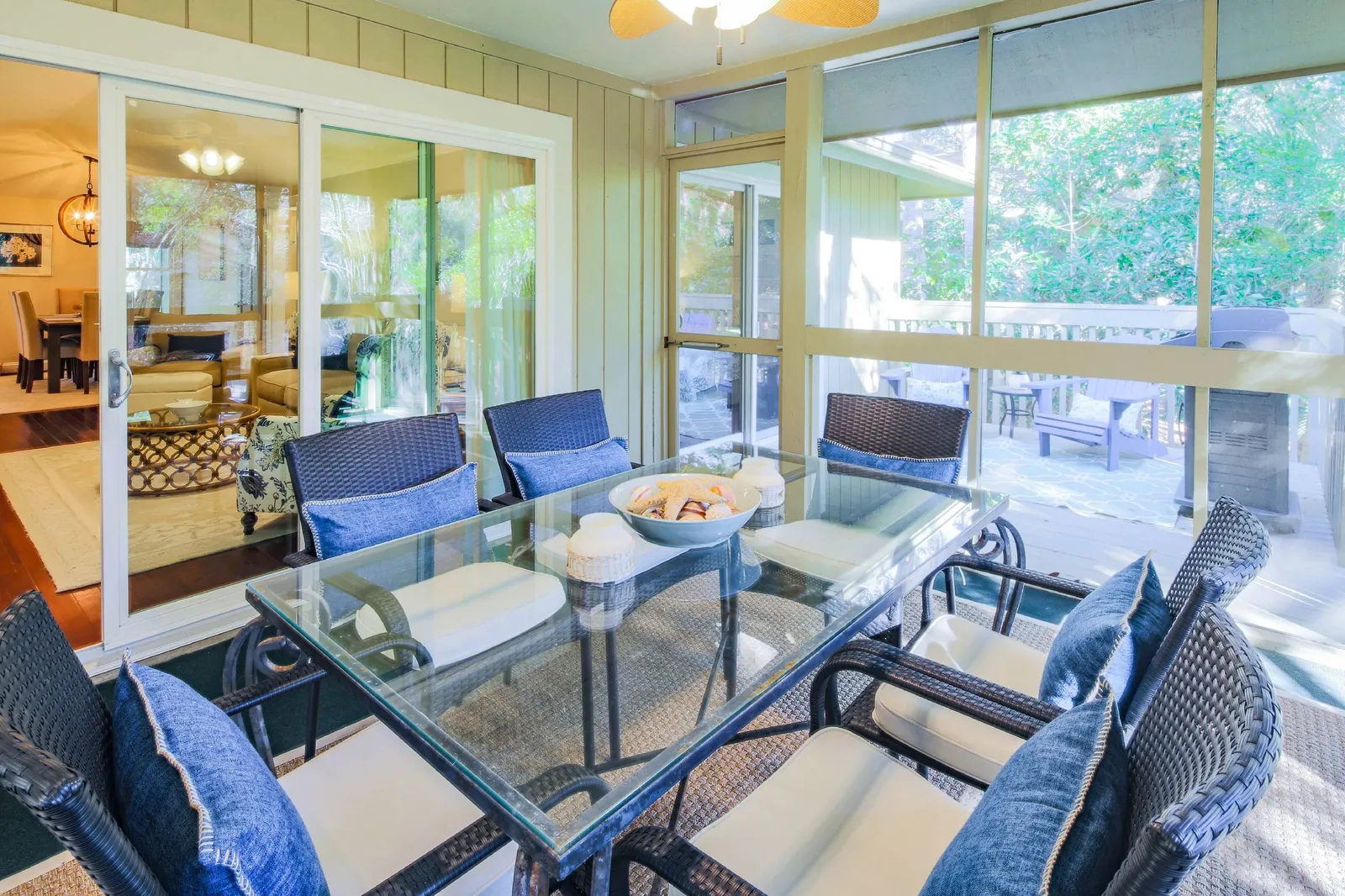 The delightful screened porch features an outdoor dining that seats 6.
