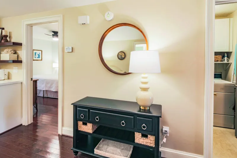 The primary suite is located off of the living room adjacent to the laundry room.