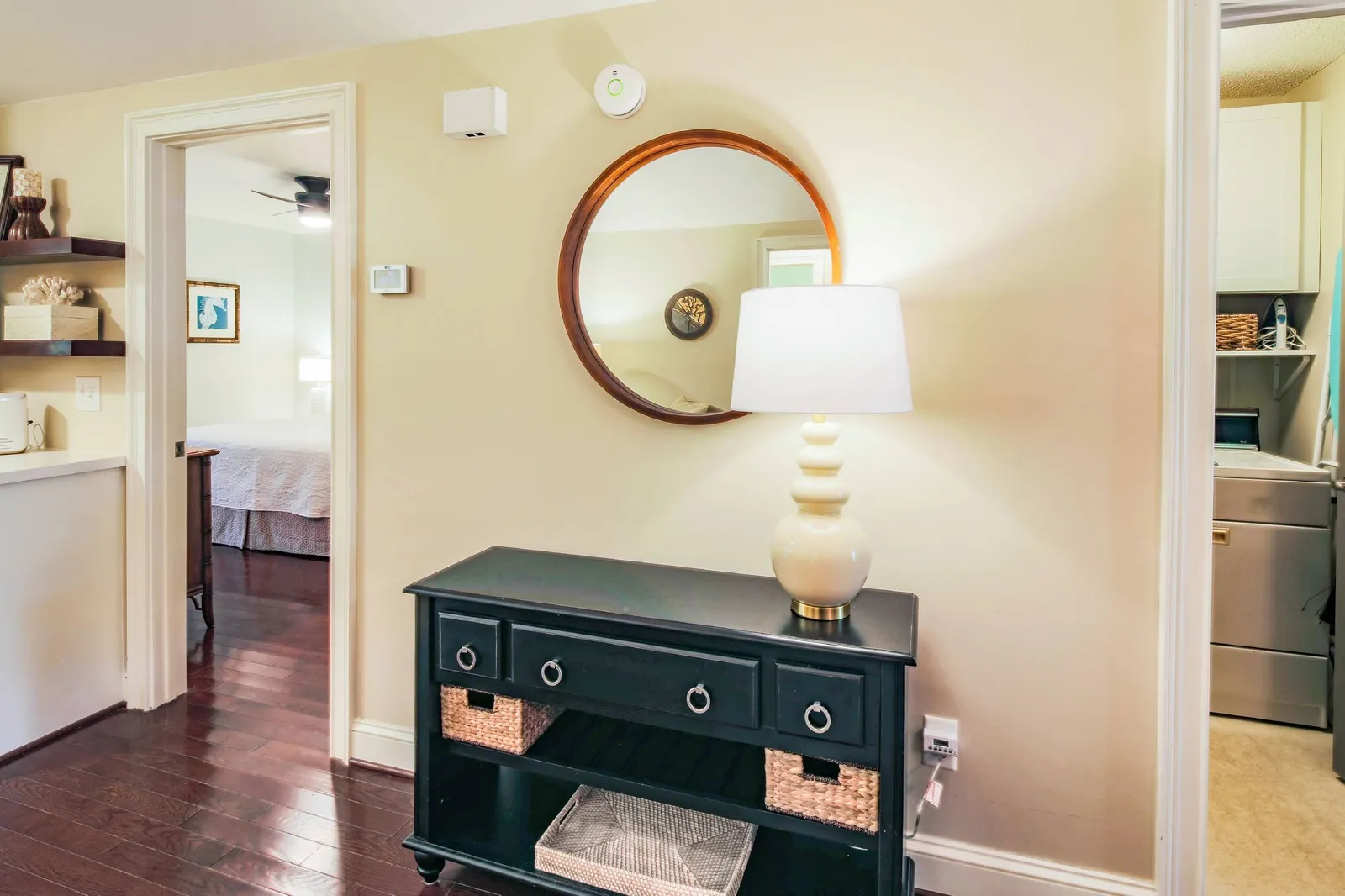 The primary suite is located off of the living room adjacent to the laundry room.