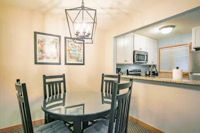 The dining table comfortably seats four.