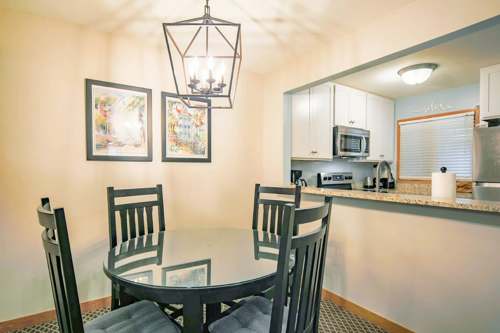 The dining table comfortably seats four.