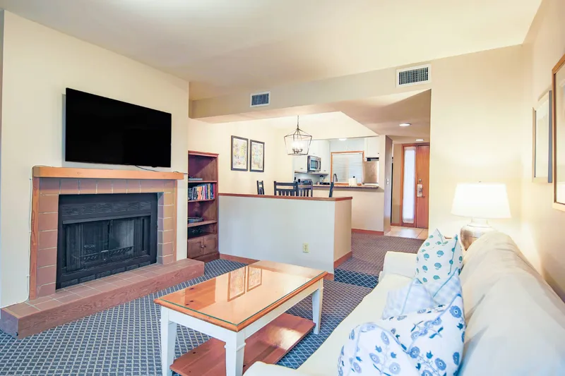 The kitchen flows into the dining area and living room. Fireplace is not available for guest use.