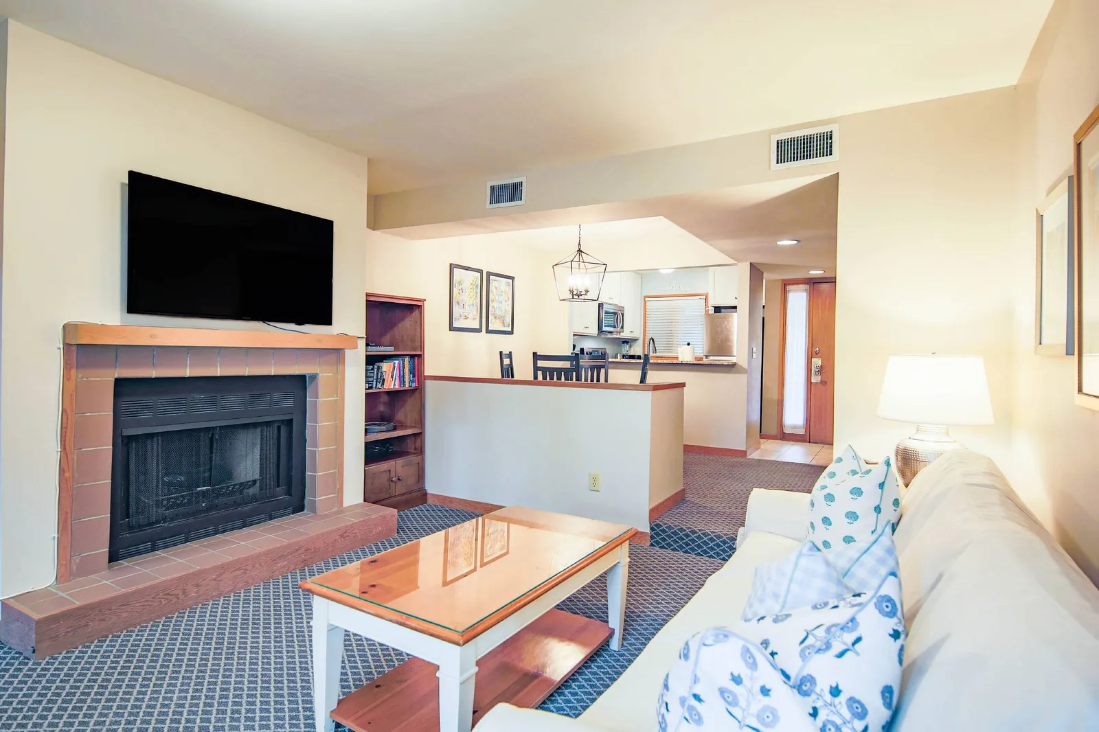 The kitchen flows into the dining area and living room. Fireplace is not available for guest use.