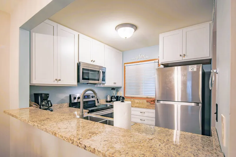 There's plenty of room in the kitchen for you and your guests to prepare your meals.