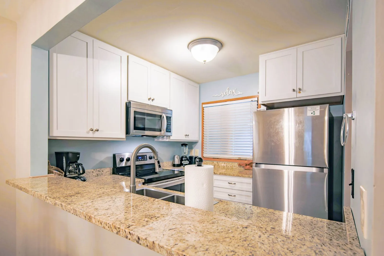 There's plenty of room in the kitchen for you and your guests to prepare your meals.