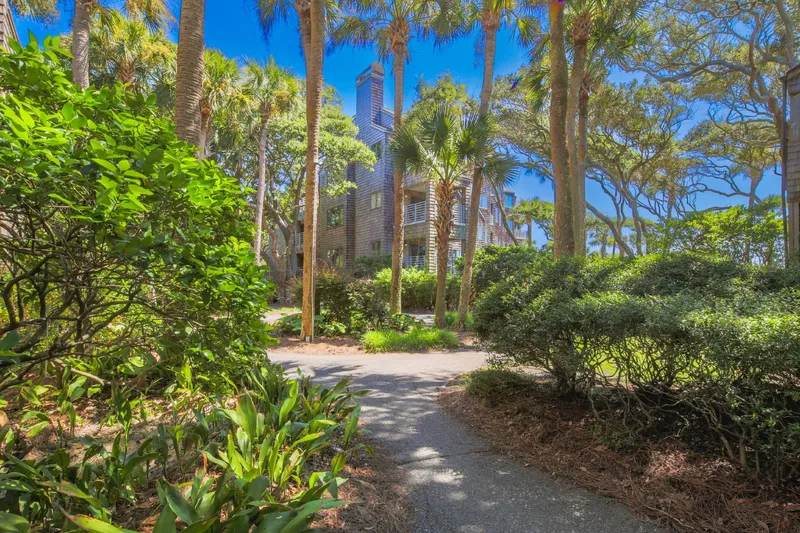 Follow the sidewalk within the beautifully landscaped Windswept community to find the boardwalk and beach access point.