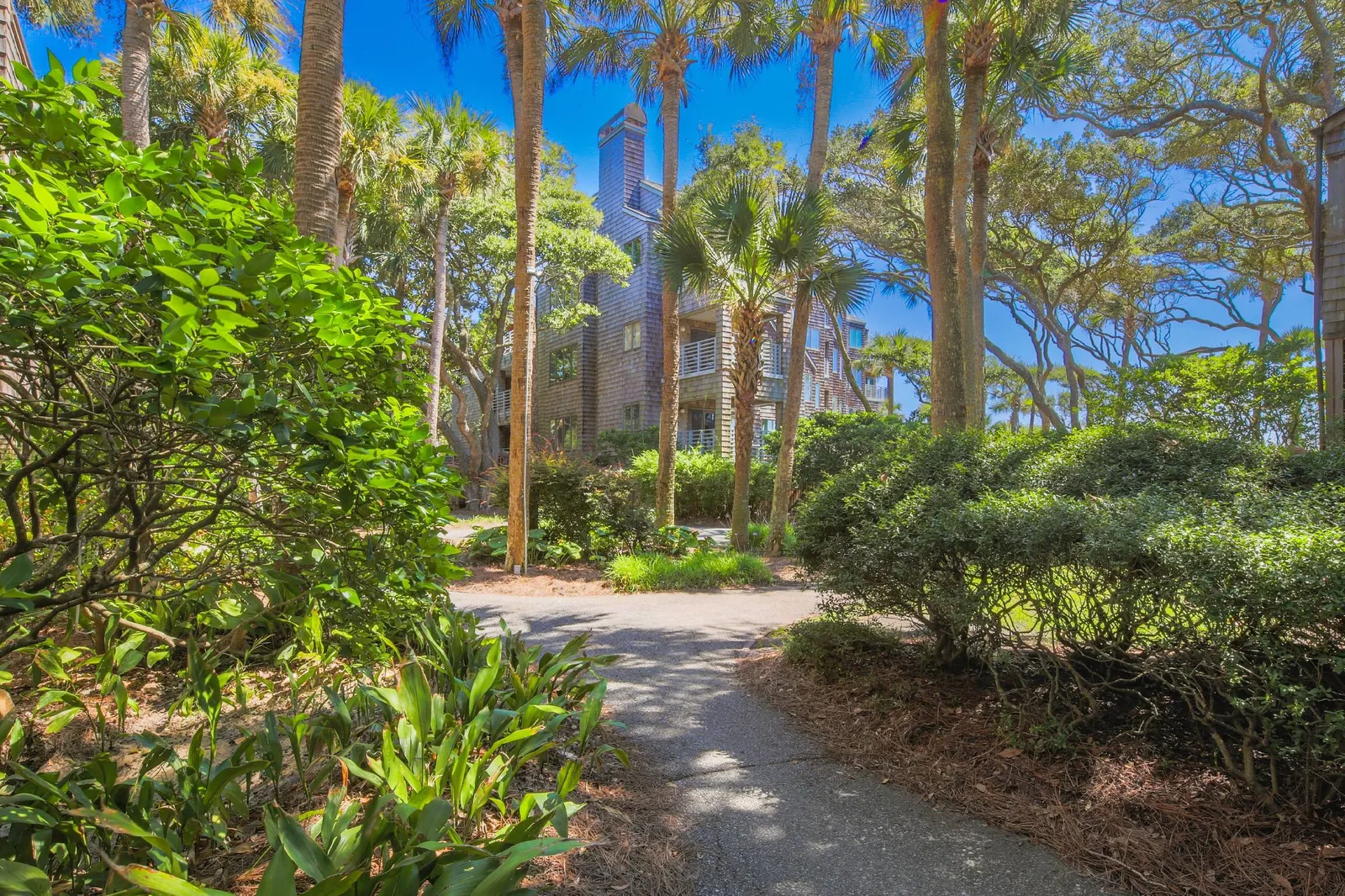 Follow the sidewalk within the beautifully landscaped Windswept community to find the boardwalk and beach access point.