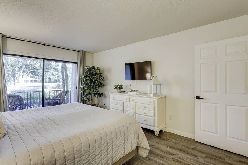 Primary Bedroom with Door Leading Out to Balcony