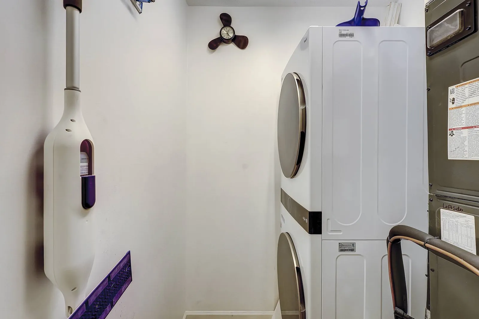 Stackable  Washer and Dryer located in the Laundry Room