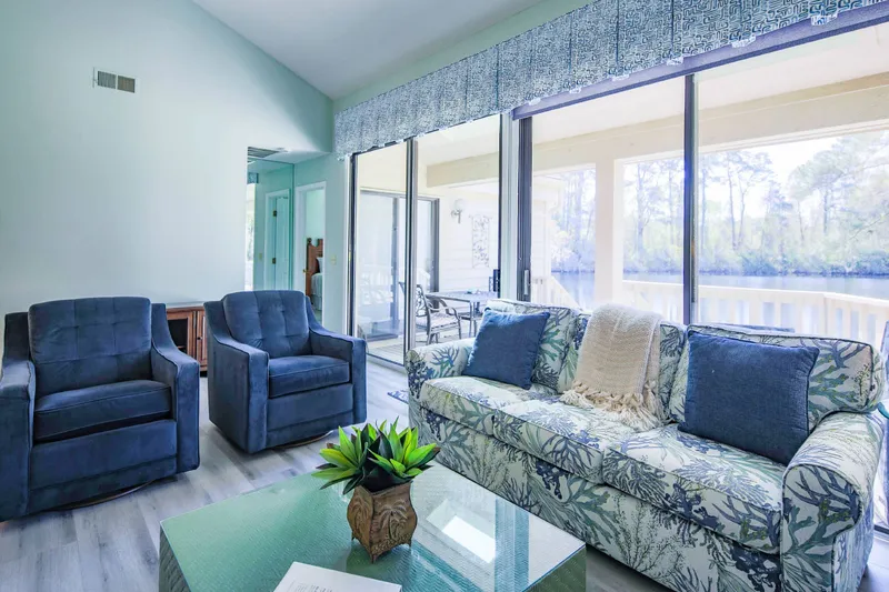 You can access the back deck via the sliding glass door in the living room (and the primary suite).