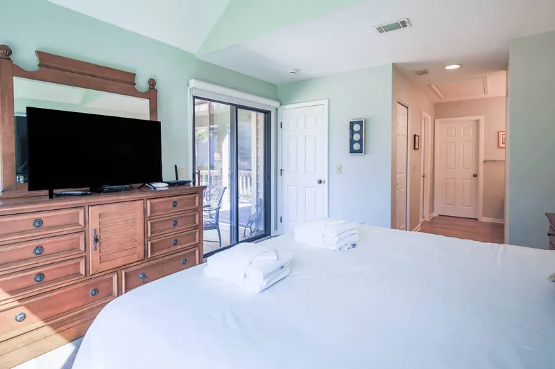 The en suite bathroom for the primary suite is on the right side of this photo.