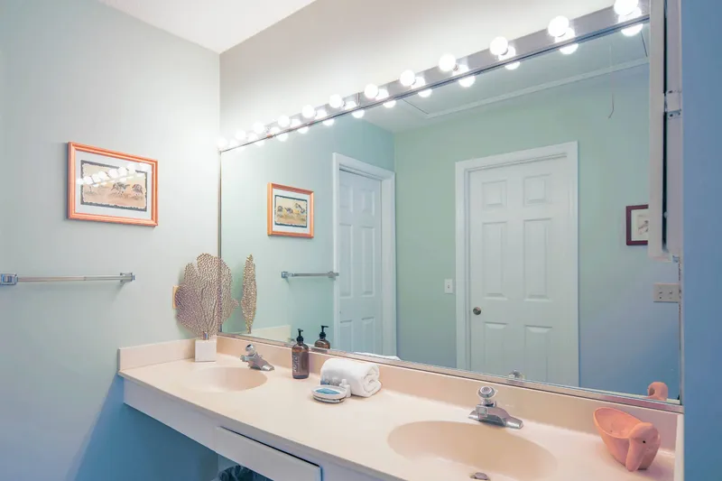 The en suite bathroom has a spacious, dual sink vanity.