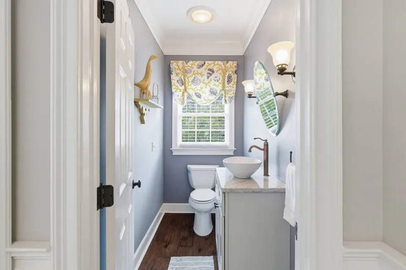 The powder room off the kitchen hallway
