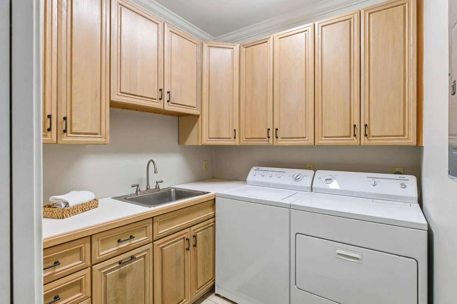 The large laundry room with full size washer and dryer