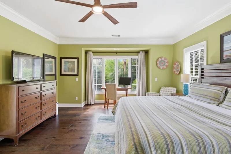 King Bed with ceiling fan, high ceiling, and plenty of space