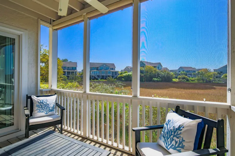 Bay Pointe Sanctuary features a screened porch with stunning marsh views.