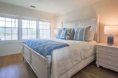 The bedroom has a king bed, lovely natural light and marsh views.