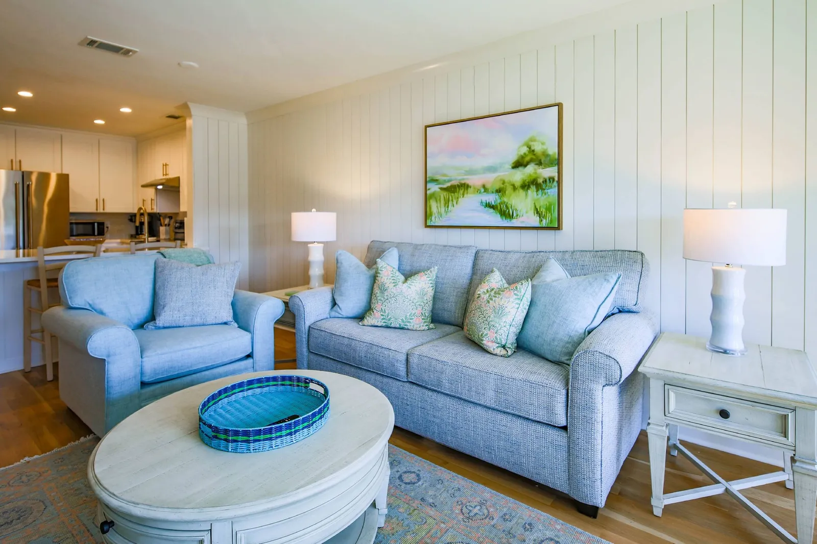 The sofa in the living room is a queen sleeper sofa bed.