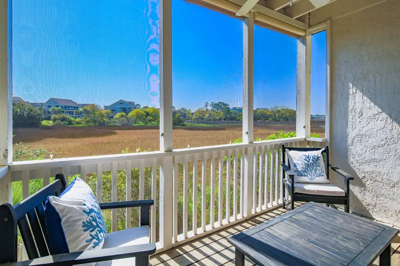 The screened porch also features mesmerizing marsh views.