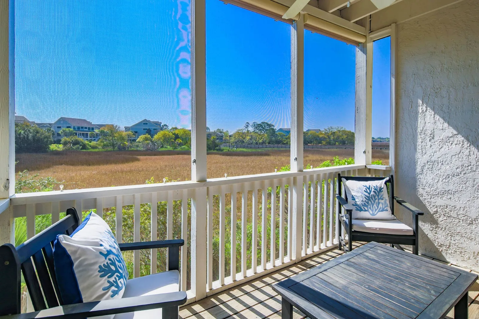The screened porch also features mesmerizing marsh views.