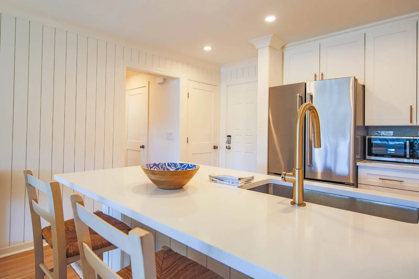 This hallway off of the kitchen leads to the bedroom, bathroom & laundry closet.