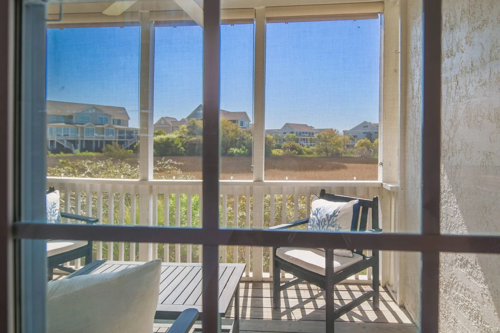 This is the view of the screened porch and marsh from the bedroom window.