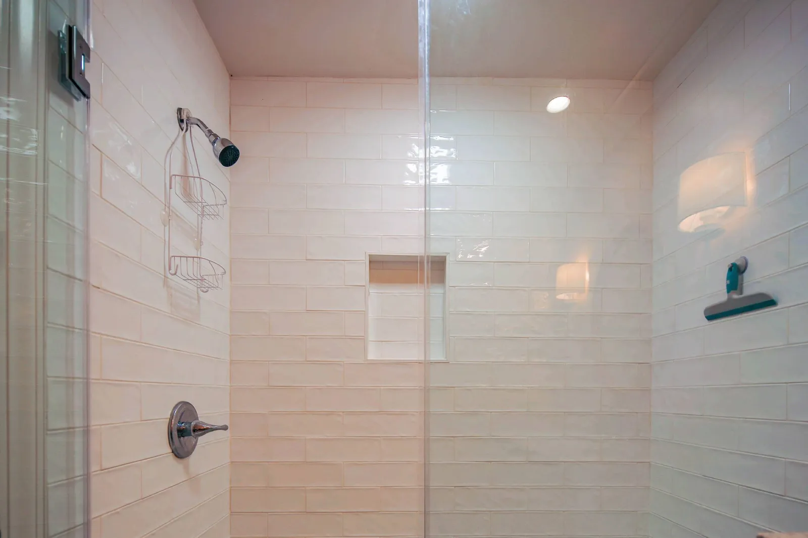 There is also a tiled, walk-in shower in the bathroom.