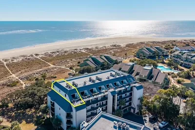 A Wave From It All is the penthouse unit marked in yellow on this photo.