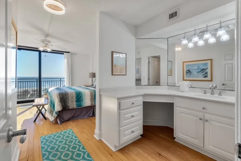 There is a spacious vanity with lots of storage area in the en suite bathroom.