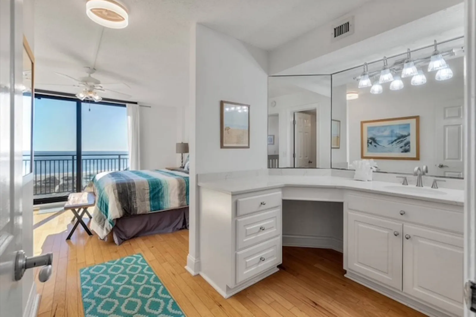 There is a spacious vanity with lots of storage area in the en suite bathroom.