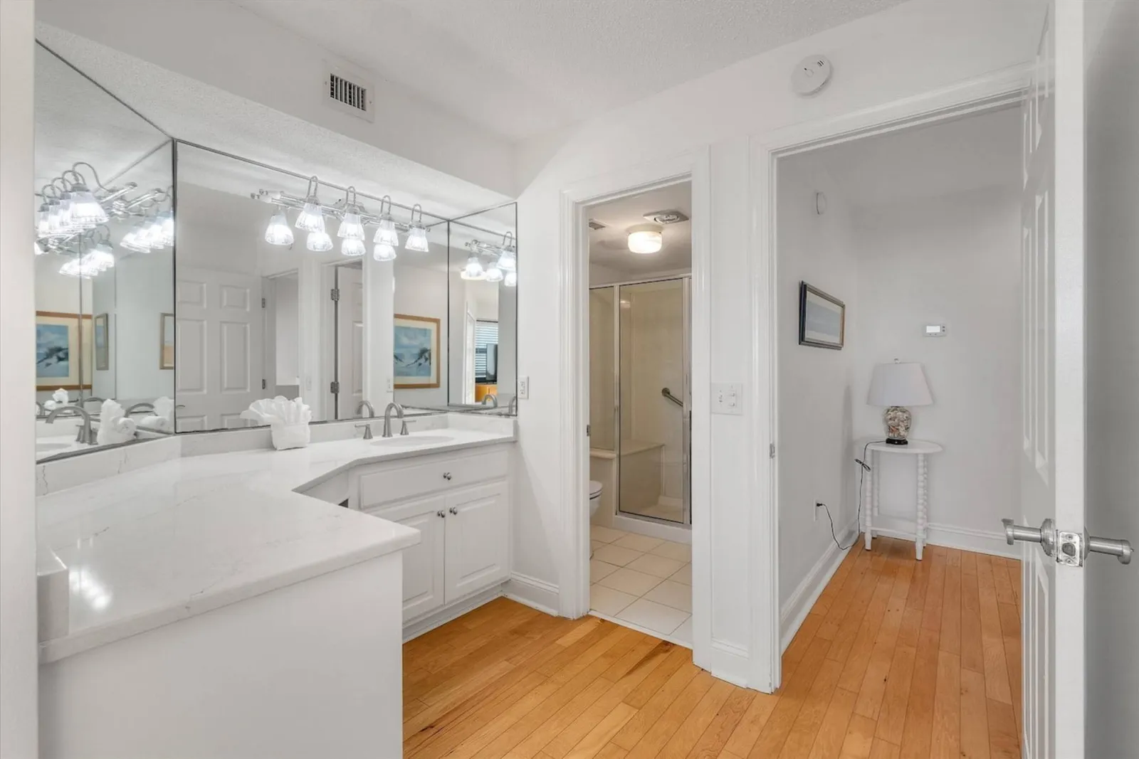 The en suite bathroom has a shower and toilet in a separate room.