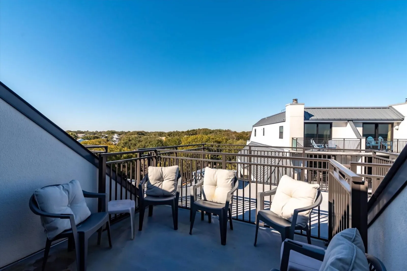 The roof deck patio features an outdoor seating area.