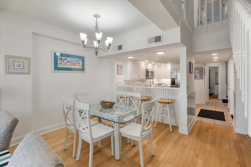 The guest bedroom on the lower level is located just down the hall from the dining area and kitchen.