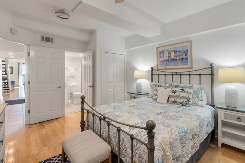 The guest bedroom has shared access to a bathroom.