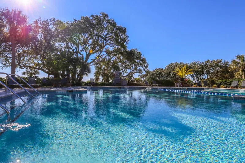 The Shipwatch community pool is spacious and lined with gorgeous landscaping & trees.