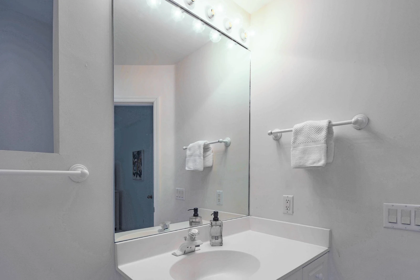 The king en suite bathroom features a spacious vanity.