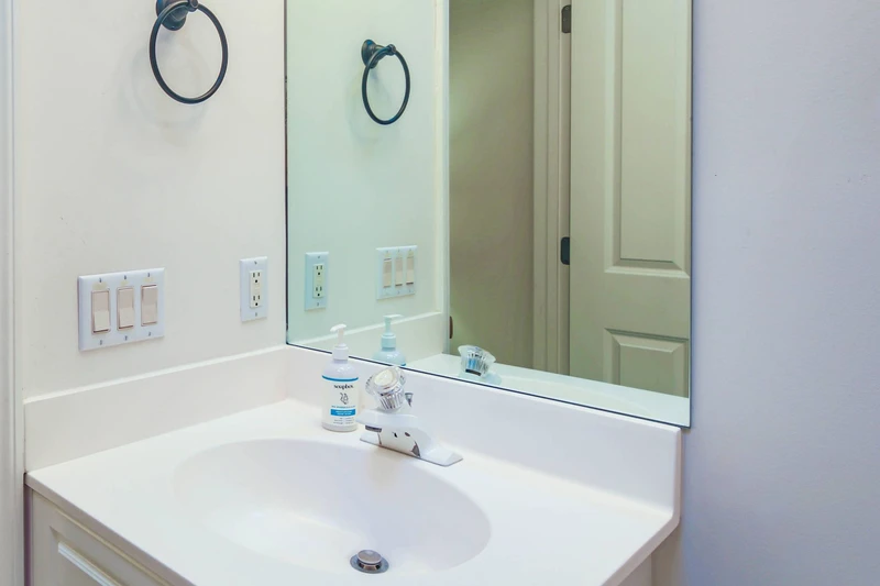 The queen en suite bathroom features a spacious vanity.