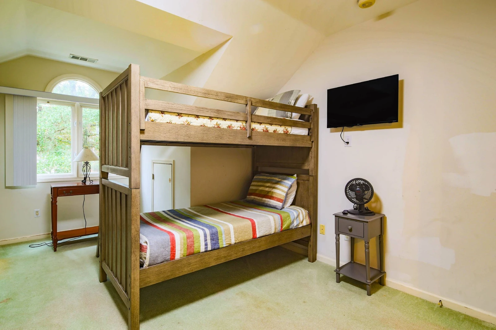 There is also a wall-mounted TV in the bunk bedroom.