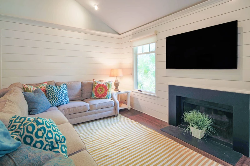 Fiddlers Hideaway features vaulted ceilings, shiplap walls and comfortable, coastal-themed decor.