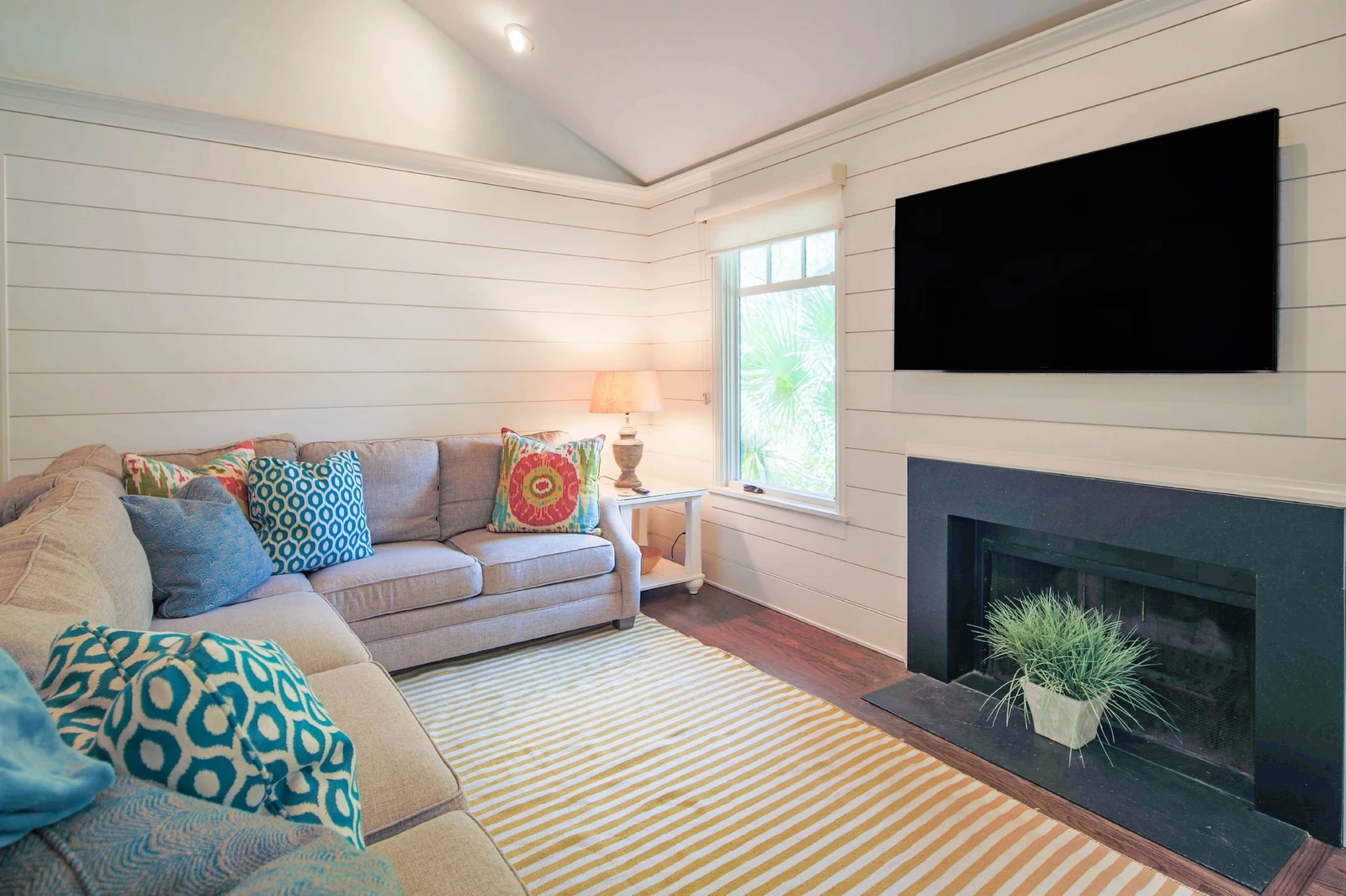 Fiddlers Hideaway features vaulted ceilings, shiplap walls and comfortable, coastal-themed decor.