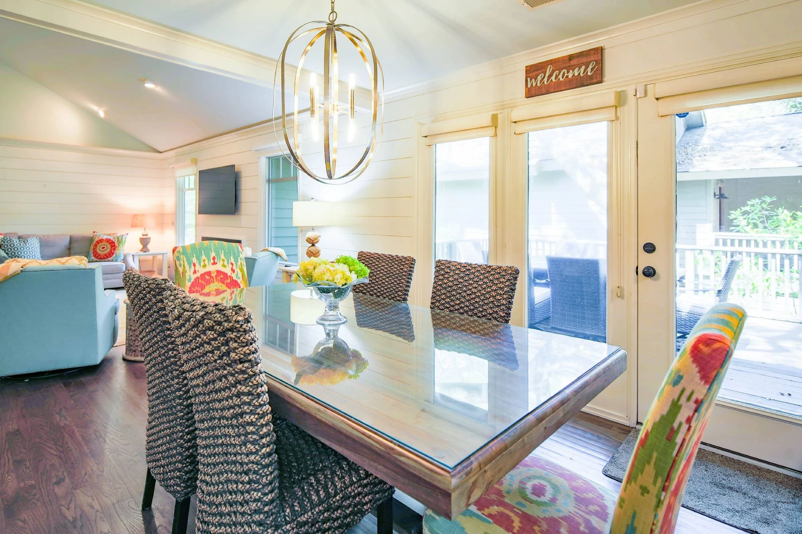 The doors near the dining table lead to the home's spacious back deck.