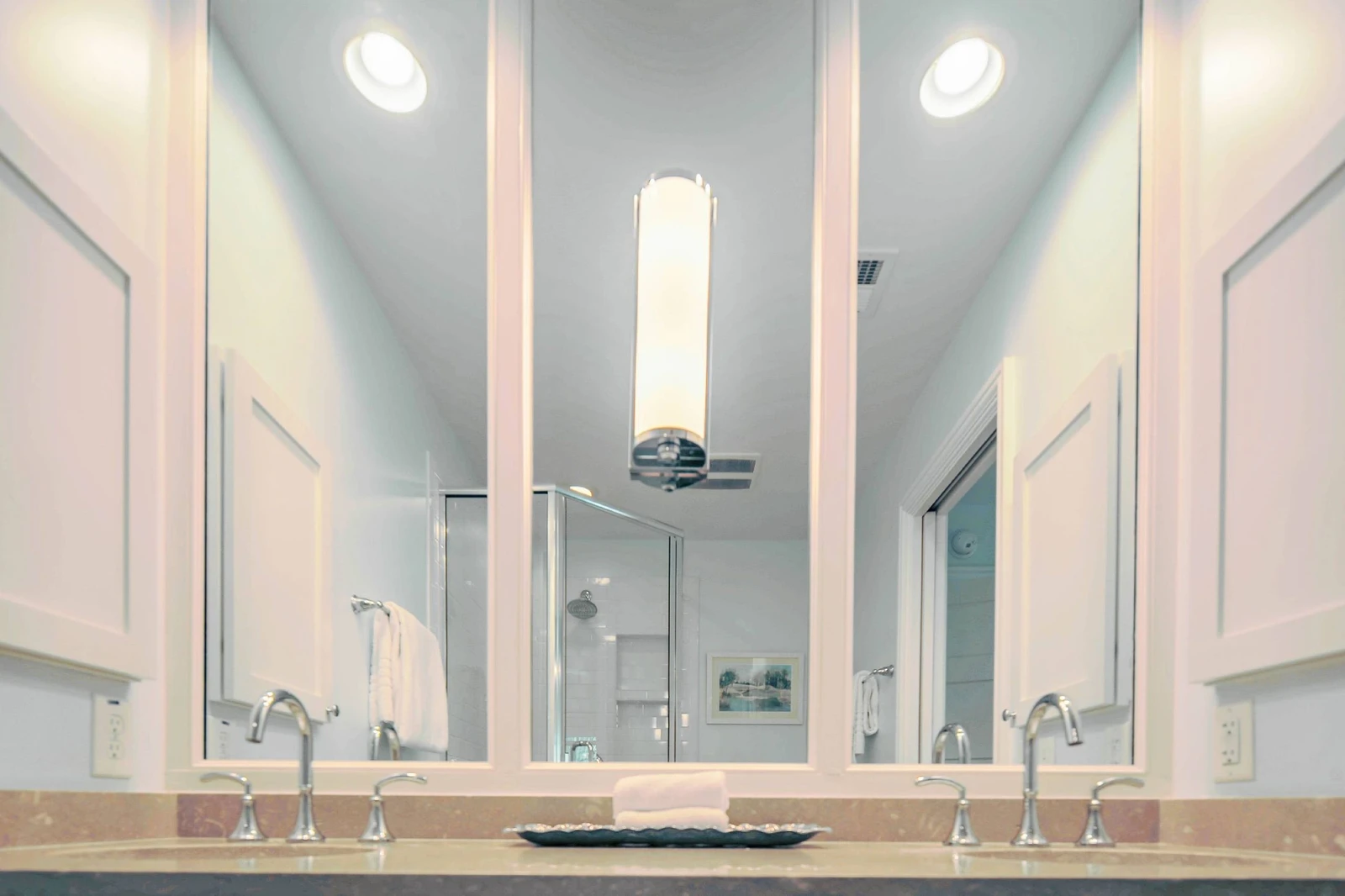 The en suite bathroom features a dual sink vanity.