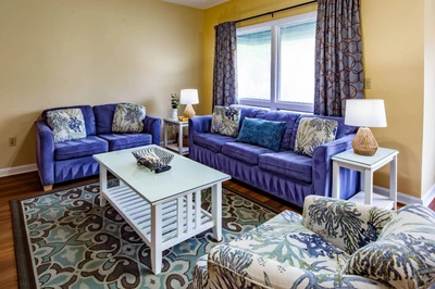 The living room features a comfortable seating area.