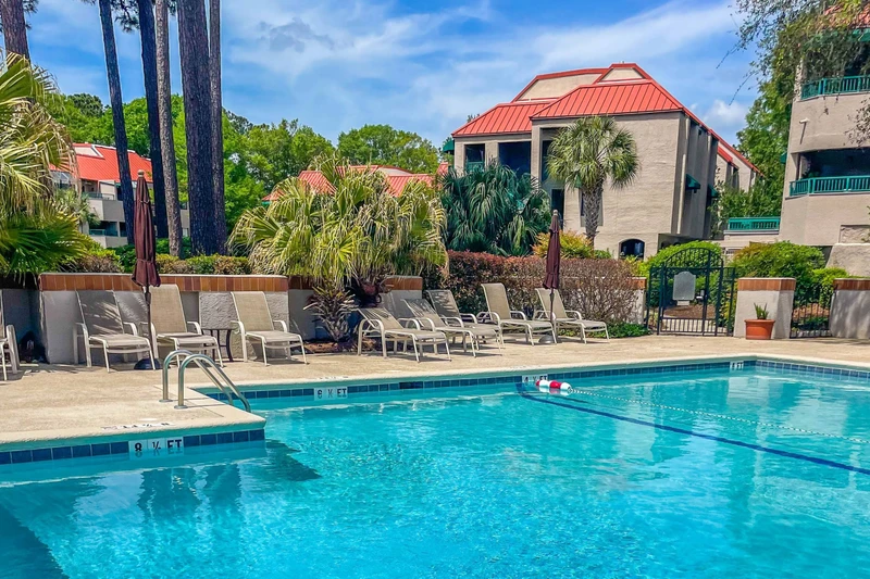 The Anchorage community pool features a spacious sundeck with lounge chairs.